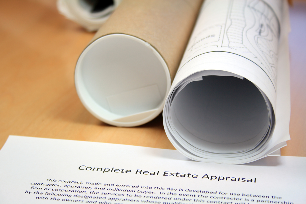 Closeup of Real Estate Appraisal and Blueprints